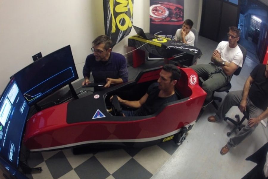 Atalanta footballers German Denis and Lionel Scaloni try out the F1 simulator